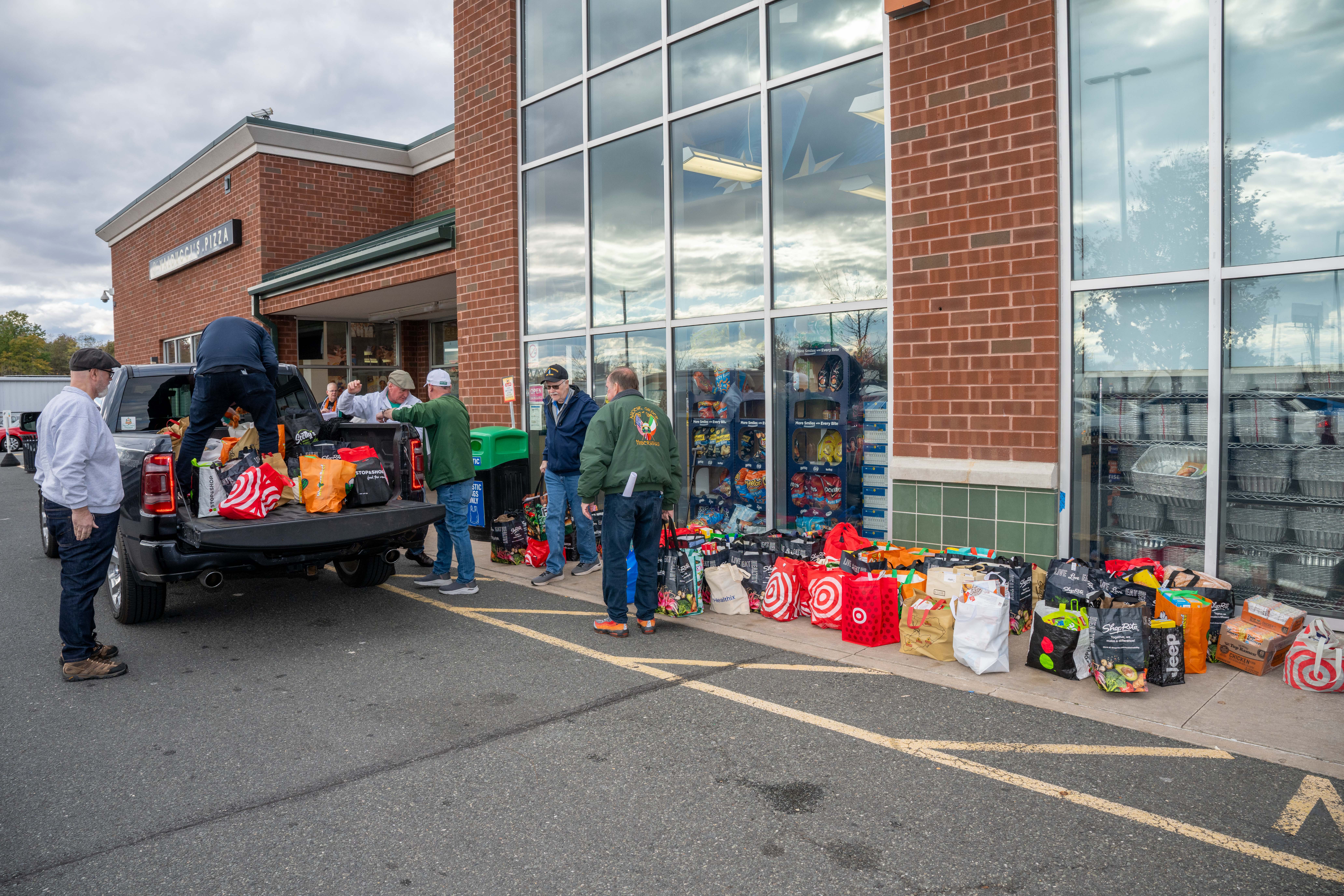 Hundreds of people donate food and/or money to the Ancient Order of Hibernians’ food drive for Blue Star Families on Saturday, November 1, 2025, in Charleston. The proceeds will benefit military families at Fort Wadsworth. (Owen Reiter for the Advance/SILive.com)