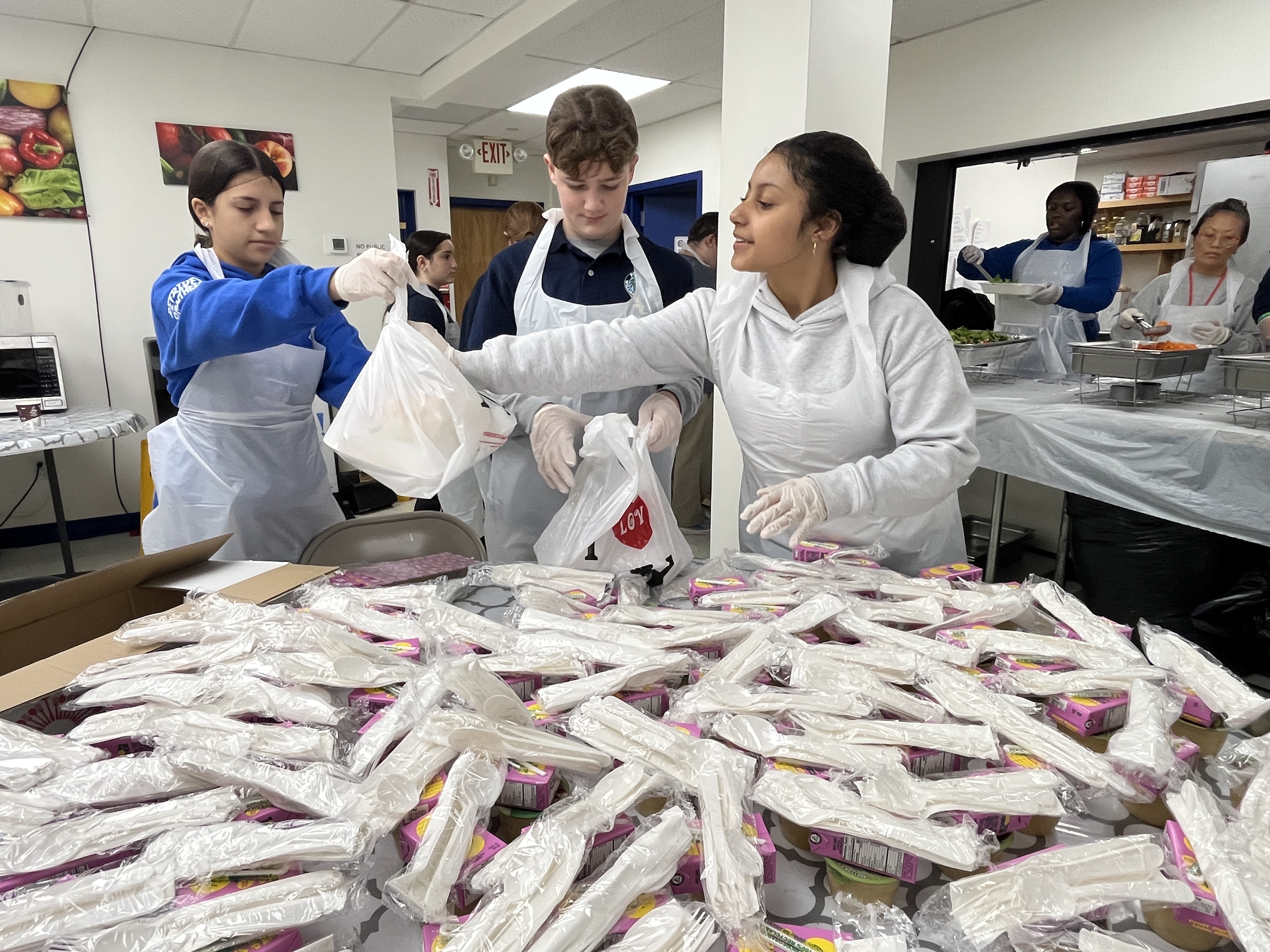Students volunteer their time ahead of the annual Project Hospitality Poor People's Dinner, which is on Monday. (Advance/SILive.com | Jan Somma-Hammel)