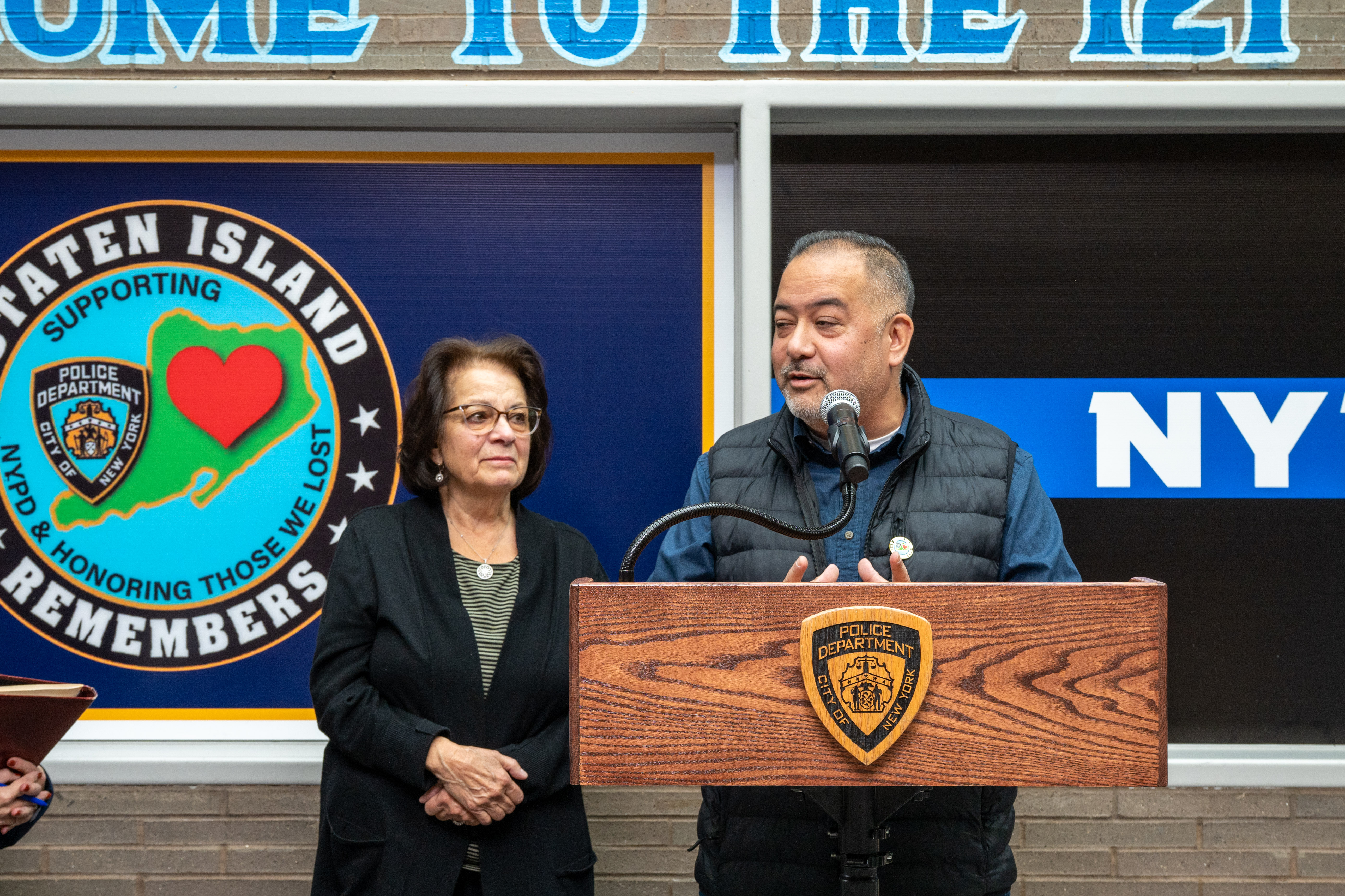The family of Detective Kenny Fung at the 121st Precinct on Saturday, November 15, 2025, in Graniteville, for the 10th annual Staten Island Remembers, honoring fallen Staten Islanders who served in the New York Police Department. (Owen Reiter for the Advance/SILive.com)