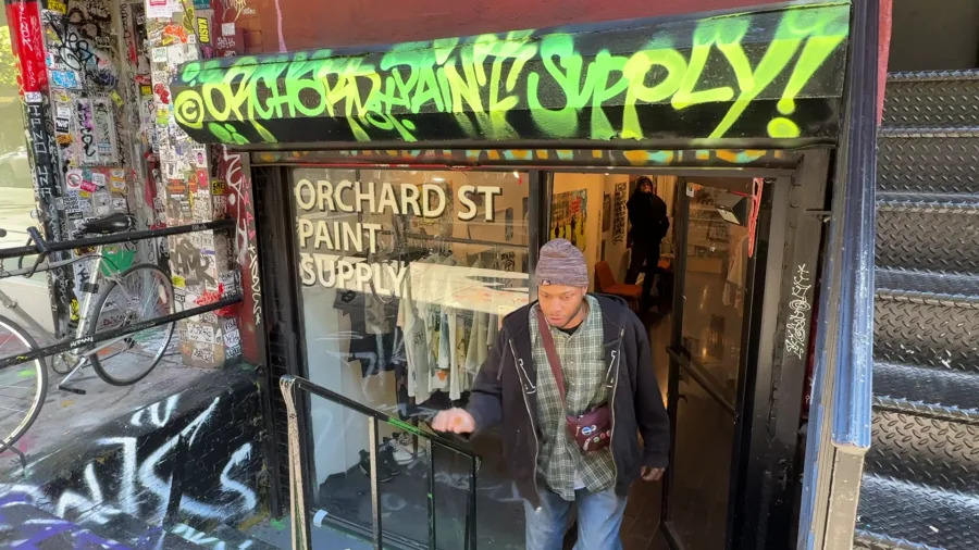 A man walks out of Orchard St. Paint Supply on Nov. 20, 2025. (Credit: PIX11)