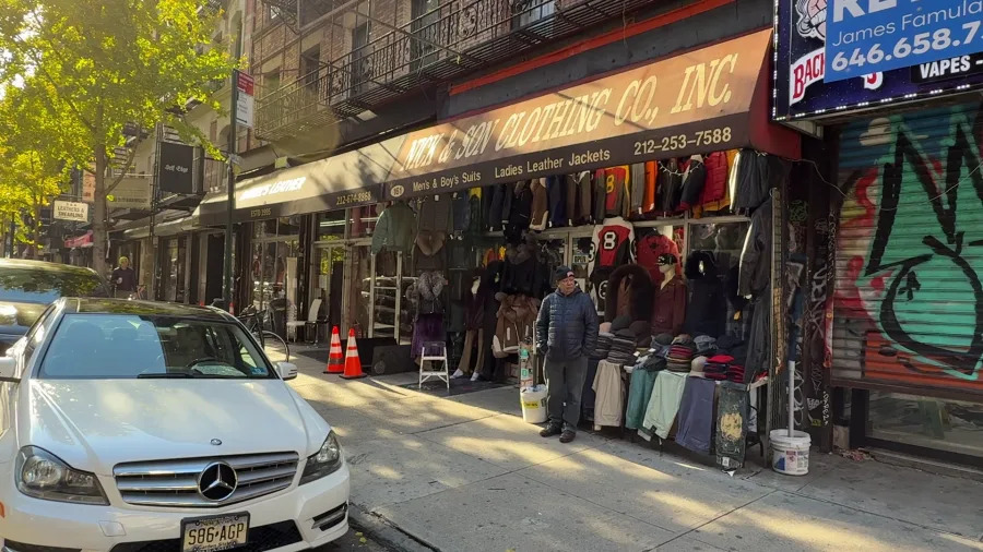 Man stands outside of Orchard Street’s Nick & Son Clothing Co., Inc. in Manhattan on Nov. 20, 2025. (Credit: PIX11)