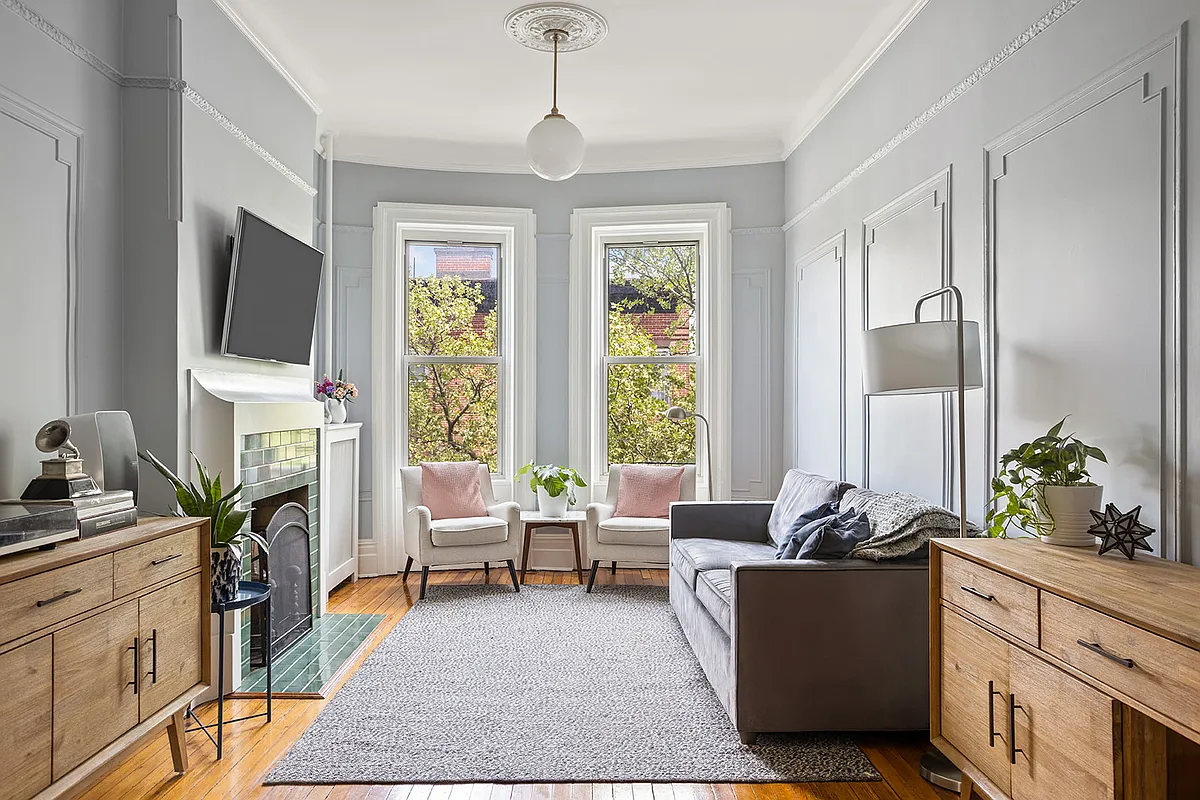 brooklyn - living room with mantel, wall moldings, wood floor