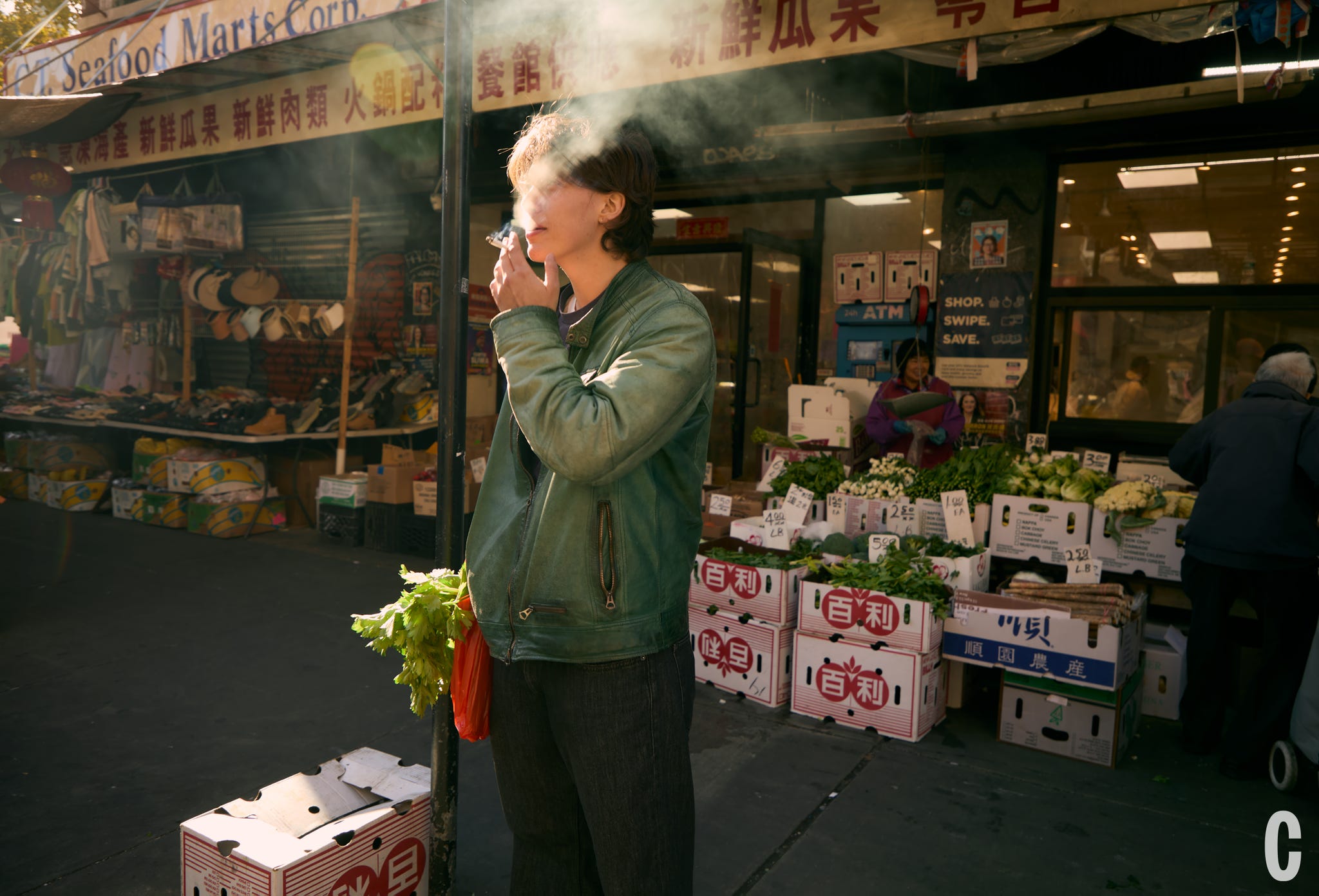 chef smoking outside fish market
