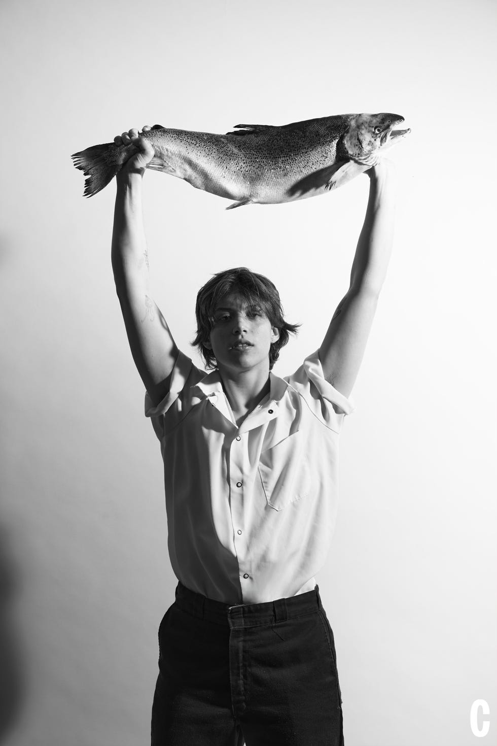 chef holding big fish