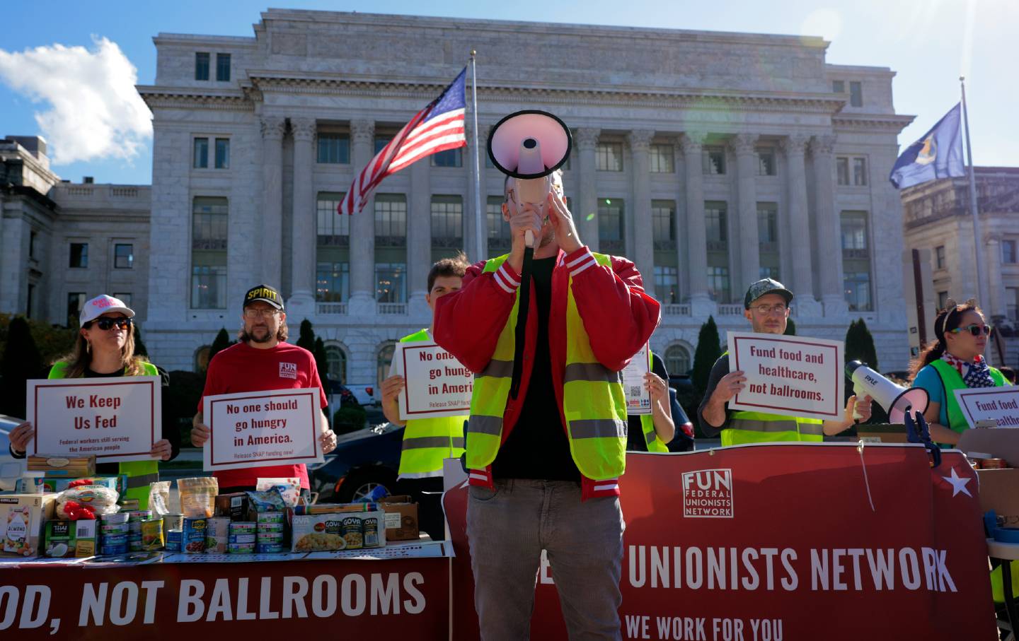 Members of the Federal Unionists Network and other unions and activist groups rally and hold a food drive in front of the US Department of Agriculture on the National Mall during the 30th day of the federal government shutdown, October 30, 2025, in Washington, DC.