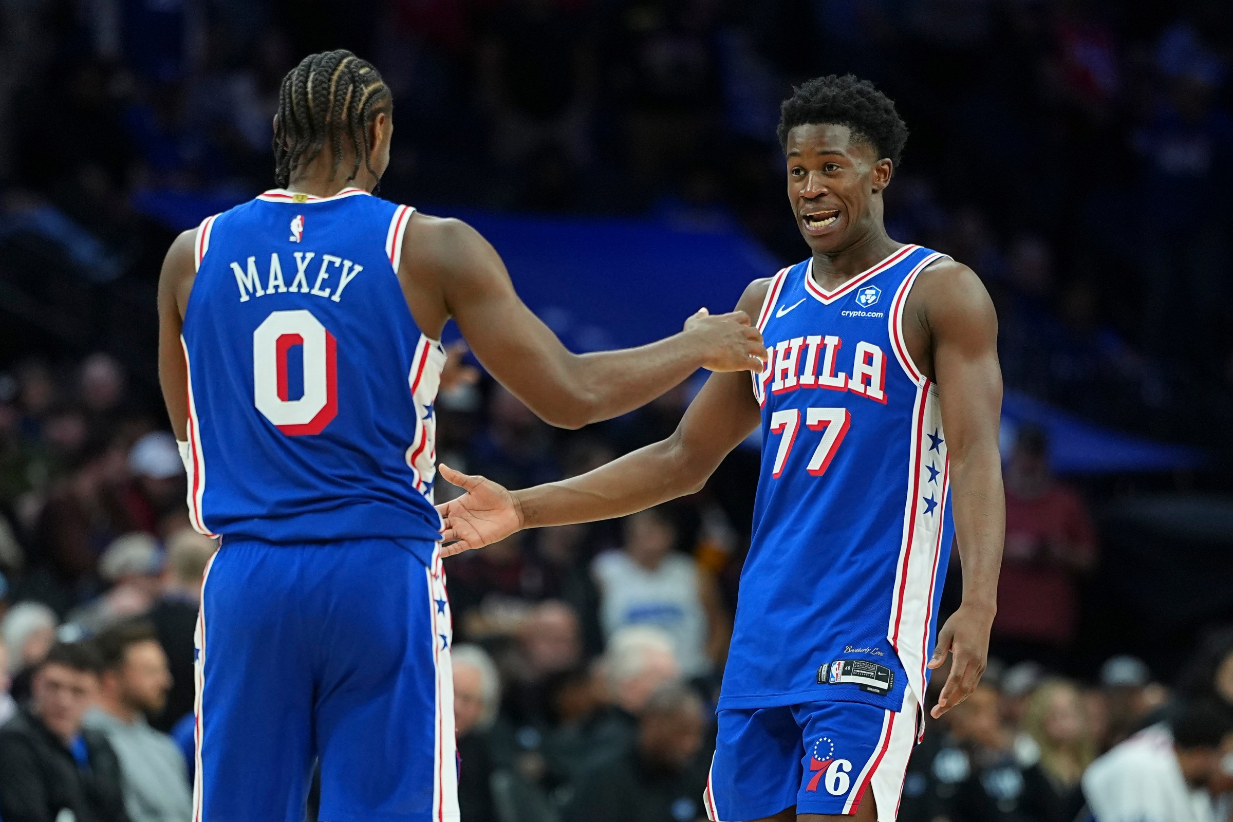 PHILADELPHIA, PENNSYLVANIA - OCTOBER 27: Tyrese Maxey #0 of the Philadelphia 76ers celebrates with VJ Edgecombe #77 against the Orlando Magic in the second half at Xfinity Mobile Arena on October 27, 2025 in Philadelphia, Pennsylvania. The 76ers defeated the Magic 136-124. NOTE TO USER: User expressly acknowledges and agrees that, by downloading and or using this photograph, User is consenting to the terms and conditions of the Getty Images License Agreement. (Photo by Mitchell Leff/Getty Images)
