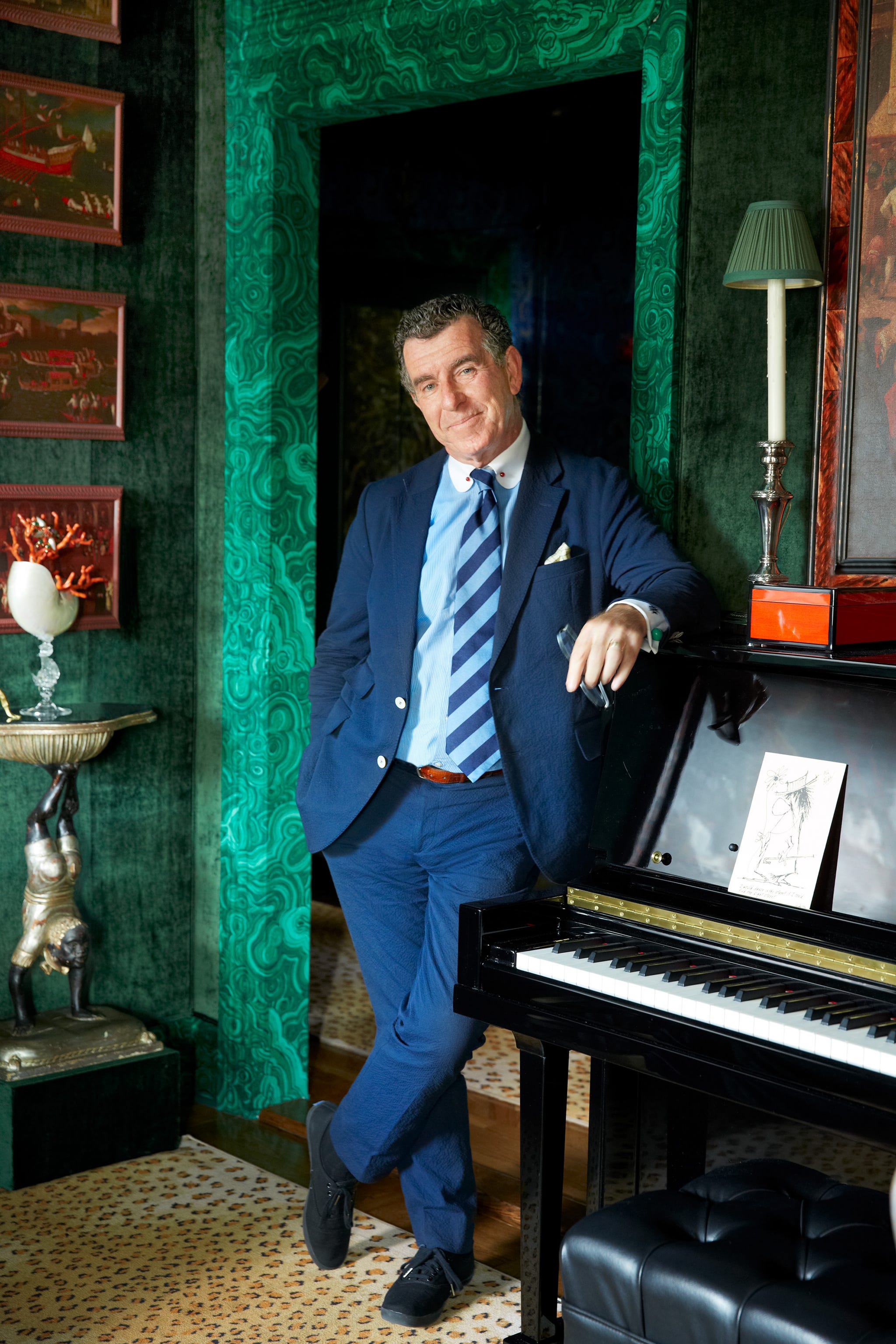 hutton wilkinson portrait in drawing room standing in a suit.