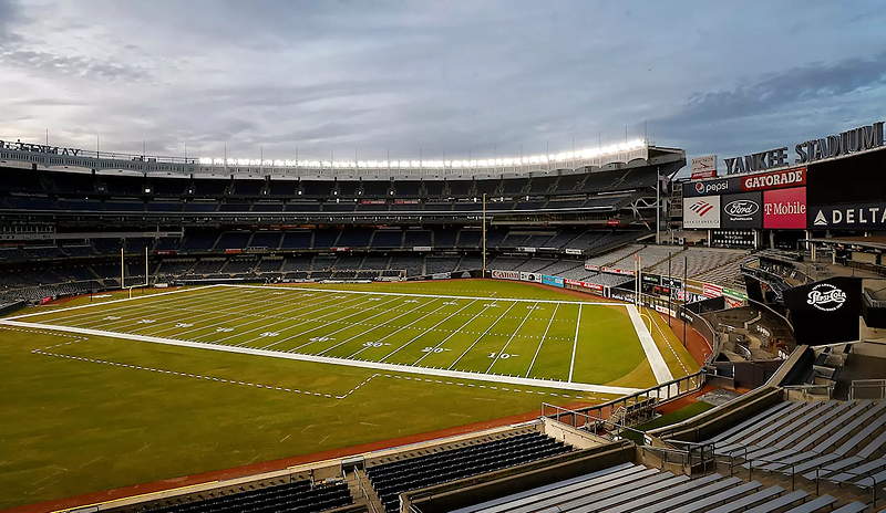 A view inside Yankee Stadium, with the field striped for football