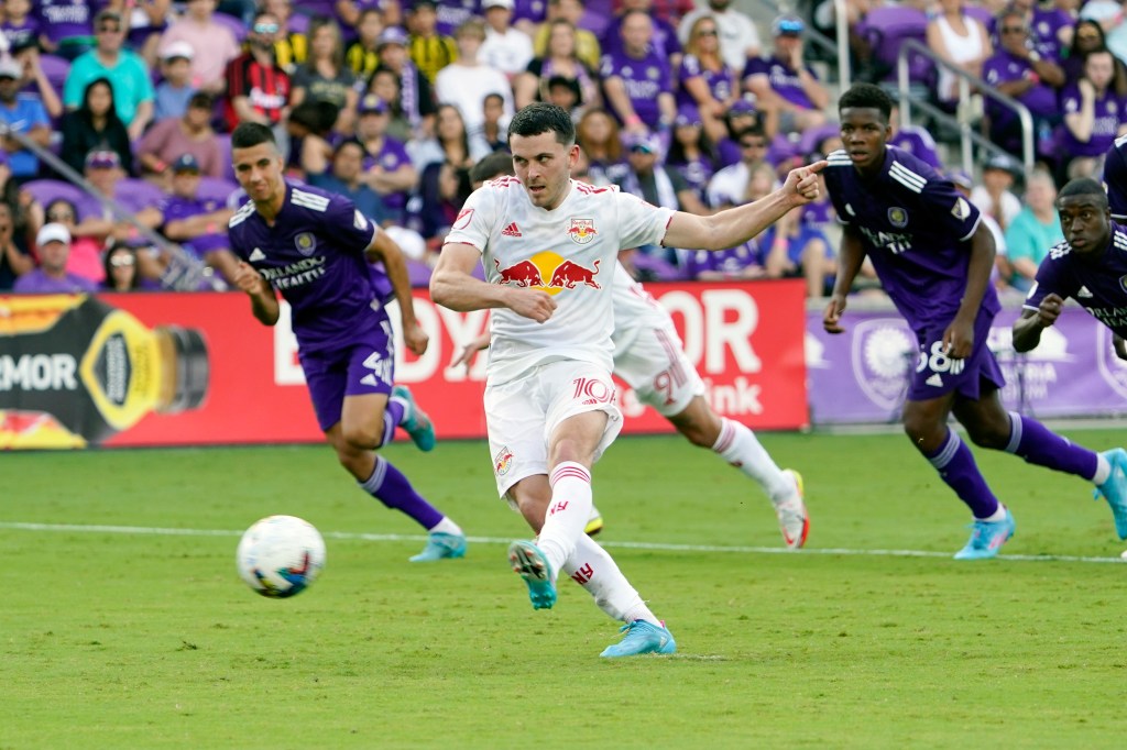 New York Red Bulls midfielder Lewis Morgan (10) scores against Orlando City on a penalty kick.