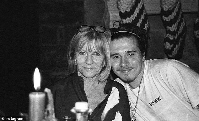 Friends of the Beckham family say that Jackie ¿ and David's mum Sandra ¿ are 'very sad' at the rift that means they no longer see Brooklyn, especially because they were always so close (Brooklyn pictured with Jackie)