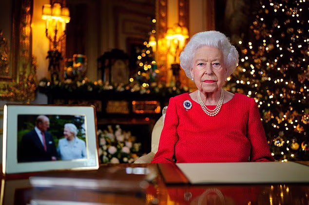 The late Queen Elizabeth II during her last ever Christmas broadcast with just a photograph of her 'beloved' Philip taken on her wedding anniversary