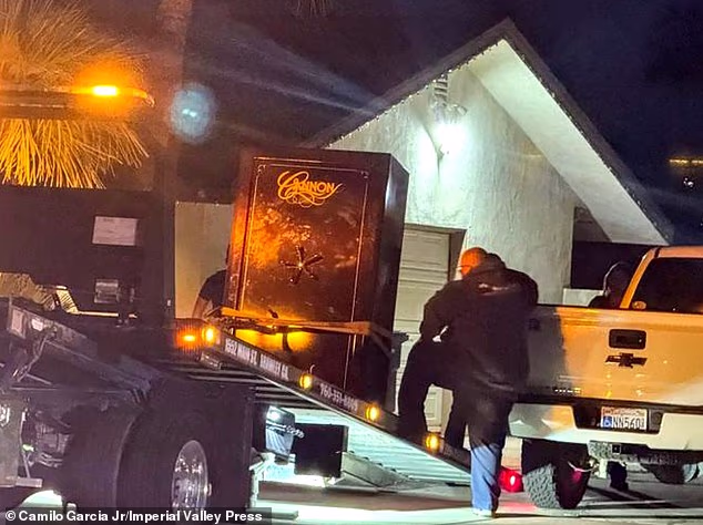 Pictured: Investigators at load a black gun safe into a truck from Michael Abatti's property on December 2. Michael has not been named a person of interest or a suspect in Kerri's death