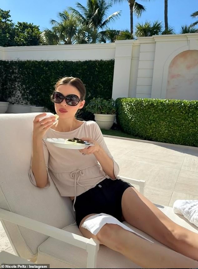 Nicola Peltz soaked up the sun in Miami, Florida as she continued to ring in the festive season with her billionaire parents