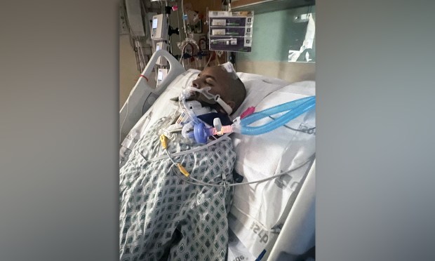 Sahan Ahmed is pictured in his hospital bed after being doored by a car while riding his scooter in Ozone Park, Queens on Nov. 18, 2025.