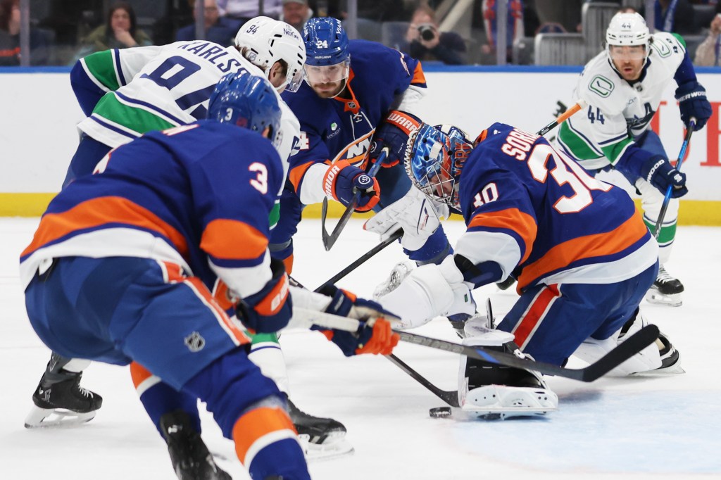 New York Islanders goaltender Ilya Sorokin (30) makes a save during the second period of a game against the Vancouver Canucks at UBS Arena in Elmont, N.Y. on Friday, Dec. 19, 2025.
