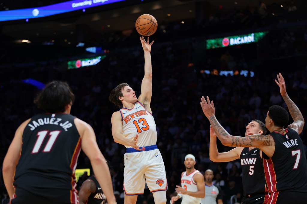 New York Knicks guard Tyler Kolek (13) shoots the basketball over Miami Heat center Kel'el Ware (7) and forward Nikola Jovic (5).