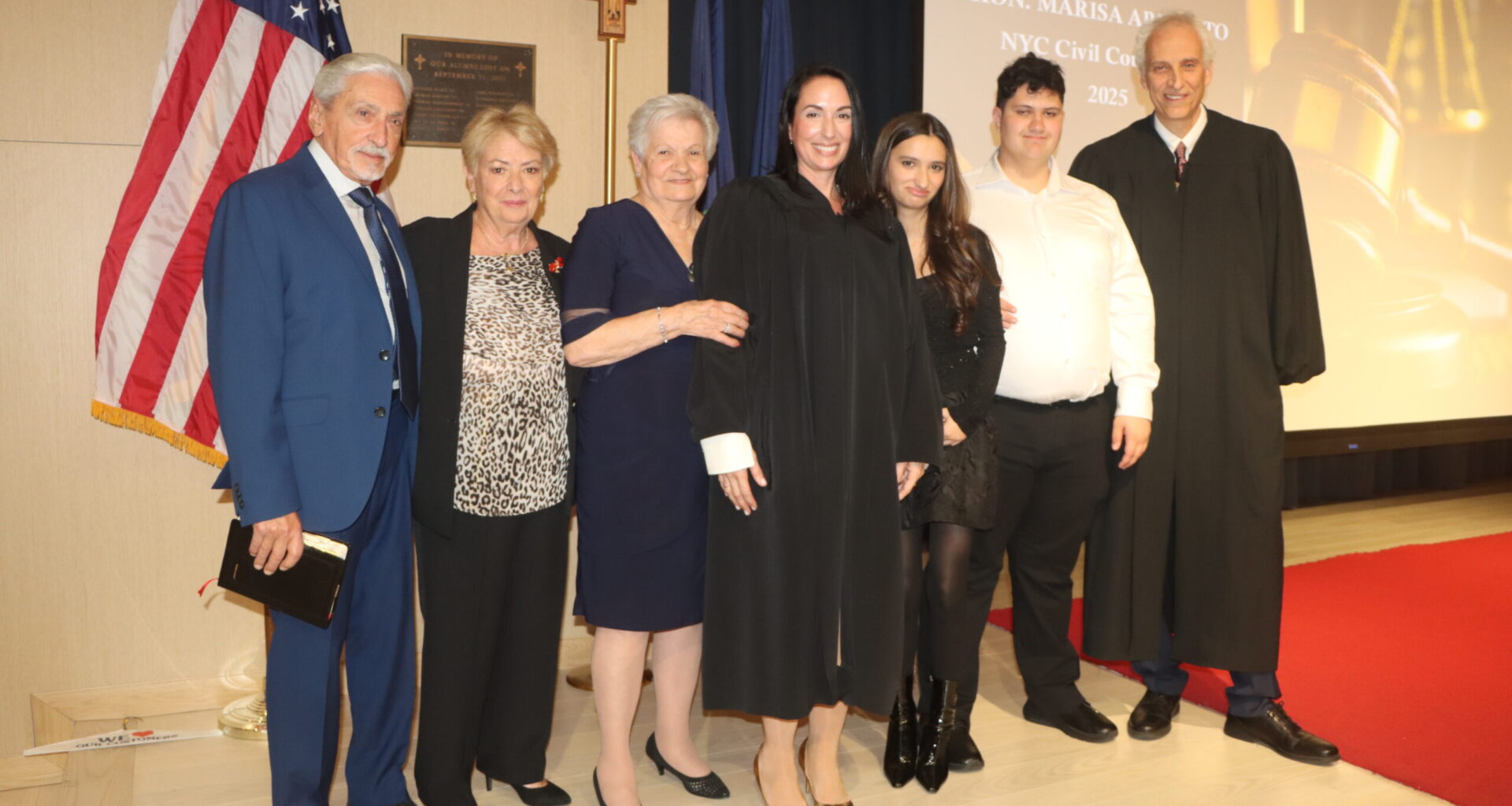 Hon. Marisa Arrabito alongside her family and Hon. Kenneth Sherman. Brooklyn Eagle photo by Mario Belluomo