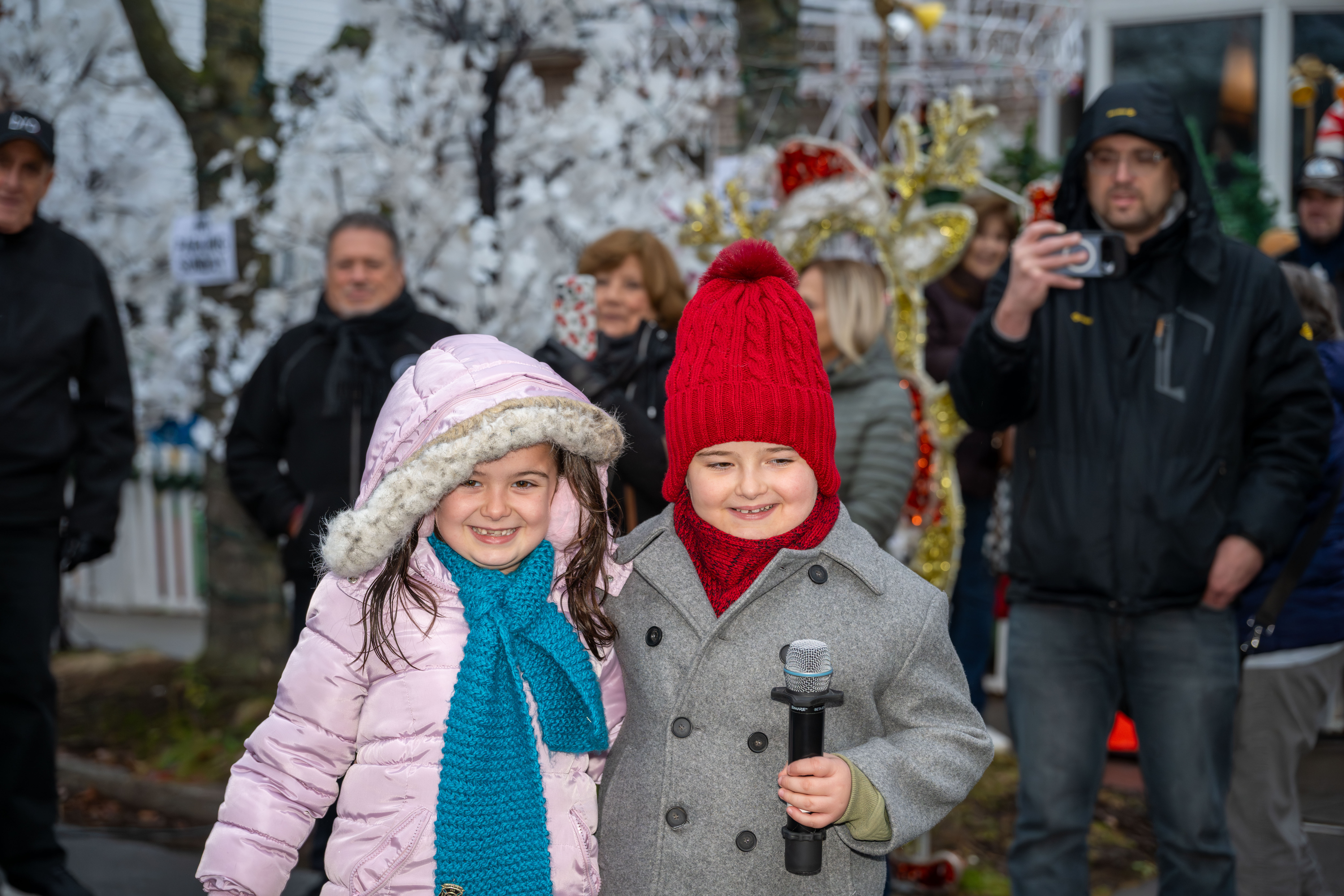 Singer Marcello DiGregorio is joined by his sister, Ariana, as he helps kick off Staten Island’s famous “Lights For Life” Christmas display at the home of Joseph and Marisa DiMartino on Sunday, November 30, 2025, in Charleston. (Owen Reiter for the Advance/SILive.com)
