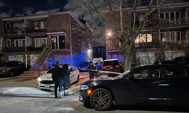 Police investigate after a man and women were stabbed multiple times inside an apartment on E. 69th St. near Ave. M in Bergen Beach, Brooklyn on Thursday night.