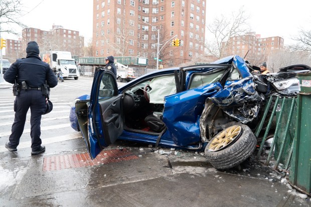 A car hit by an MTA bus is pictured at Tinton Ave. and E. 163rd St. in the Bronx on Monday, Dec. 15, 2025. 