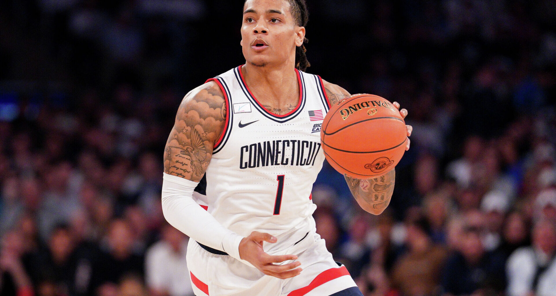 NEW YORK, NEW YORK - DECEMBER 09: Solo Ball #1 of the UConn Huskies drives the ball during the game against the Florida Gators at Madison Square Garden on December 09, 2025 in New York City. (Photo by Evan Bernstein/Getty Images)