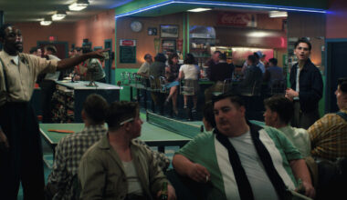 Tyler Okonma (left) and Timothée Chalamet (right) play table tennis at a bowling alley.