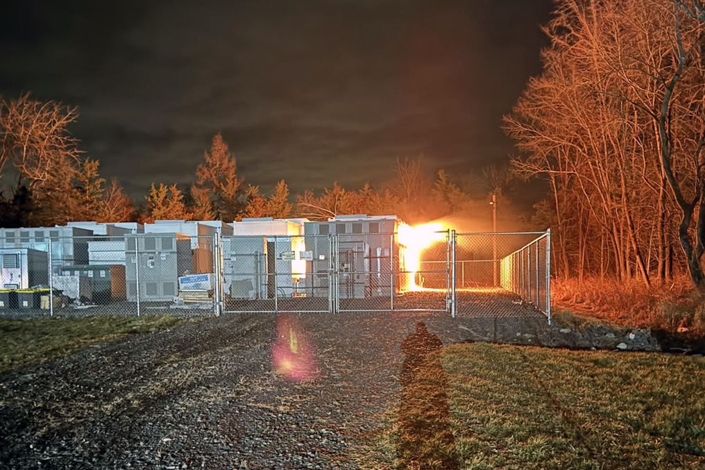 A battery energy storage system burns in Warwick. Officials said the facility, run by Convergent, caught fire on Friday.