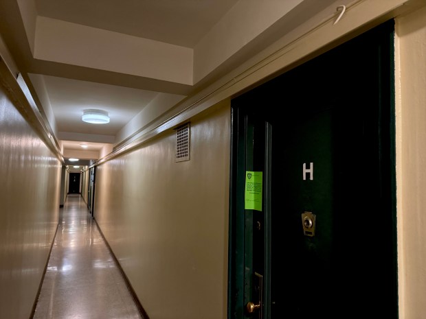 A 74-year-old woman was found dead with multiple injuries inside her apartment on Monroe St. near Market St., just a block from the Manhattan Bridge, on Saturday, Dec. 20, 2025. (Rebecca White / New York Daily News)