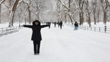 People walk in the snow in Central Park in New York City on December 27, 2025. New York City receieved around 4 inches (10 centimeters) of snow overnight. Airlines canceled 1,500 US flights during the peak holiday travel period Friday, with severe winter storm warnings and heavy snow forecast across parts of the Midwest and northeast. (Photo by TIMOTHY A. CLARY / AFP via Getty Images)