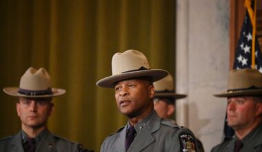 New York State Police Superintendent Steven G. James, center, took over the agency in February 2024 and undertook an immediate leadership shakeup as he sought to remake the agency. His administration has endured its own share of scandals.