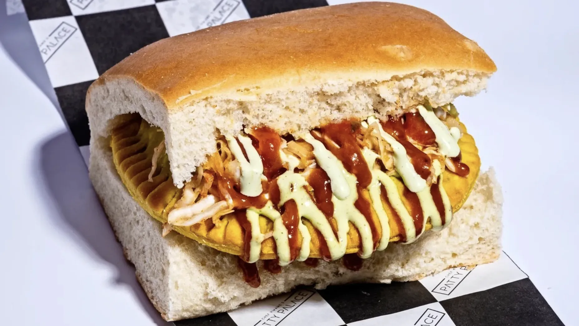 Patty from Patty Palace with herb aoli and coco bread