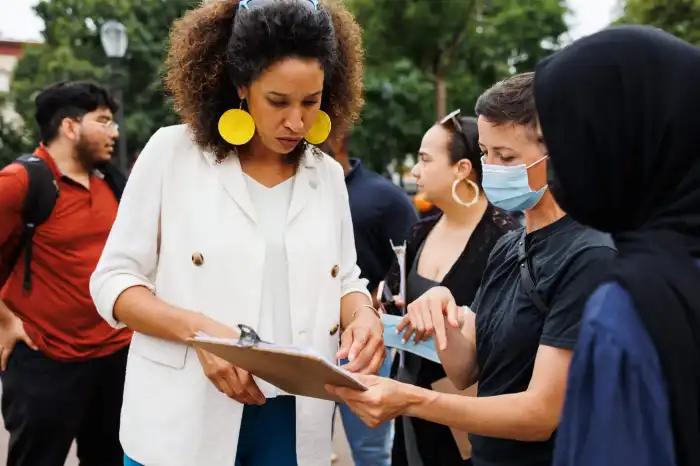 Sandy Nurse talking with tenants