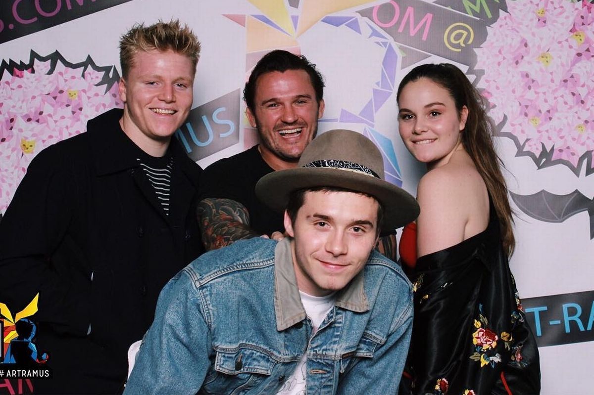 Brooklyn Beckham posing alongside Jack and Holly Ramsay and a friend