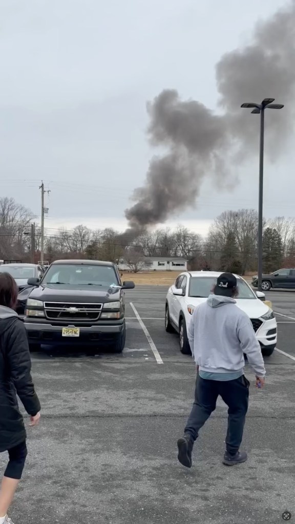 Black smoke rising over Hammonton, New Jersey after a helicopter collision.