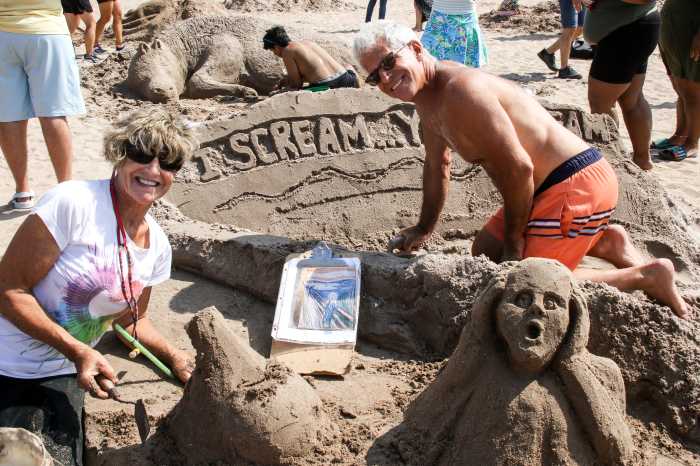 artists and sand sculpture at coney island sand sculpting contest