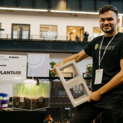Plantaer founder Manuel Benitez Ruiz with a prototype cinderblock created using the company’s ultra-durable, non-toxic concrete mix. Photo courtesy of Plantaer