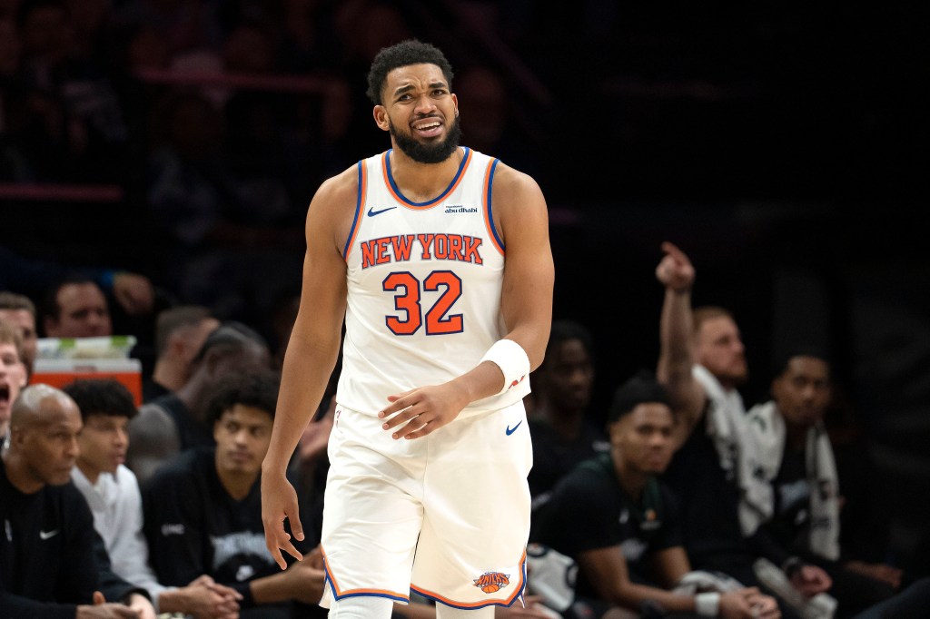 New York Knicks center Karl-Anthony Towns (32) lreacts after a foul is called against the Minnesota Timberwolves in the second half at Target Center.