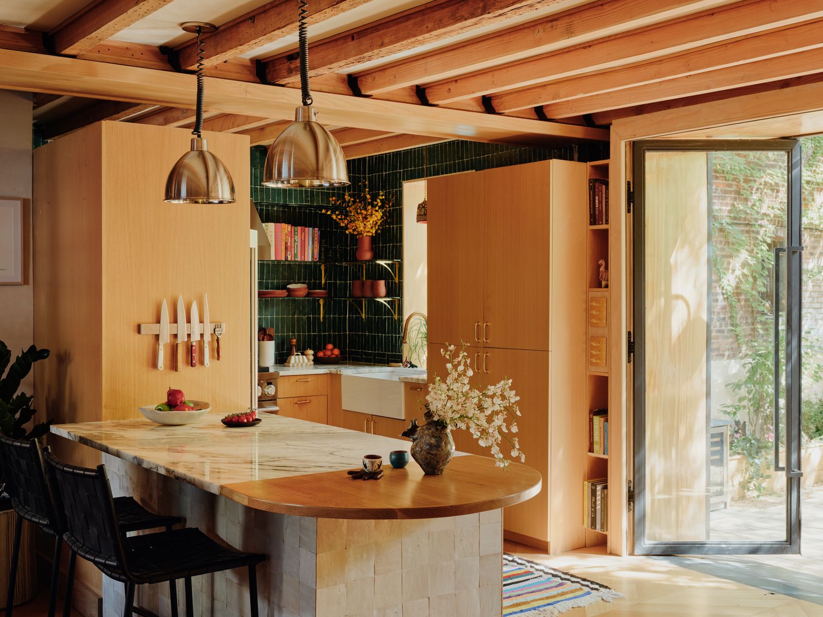 Image may contain Indoors Interior Design Kitchen Flower Plant Flower Arrangement and Furniture