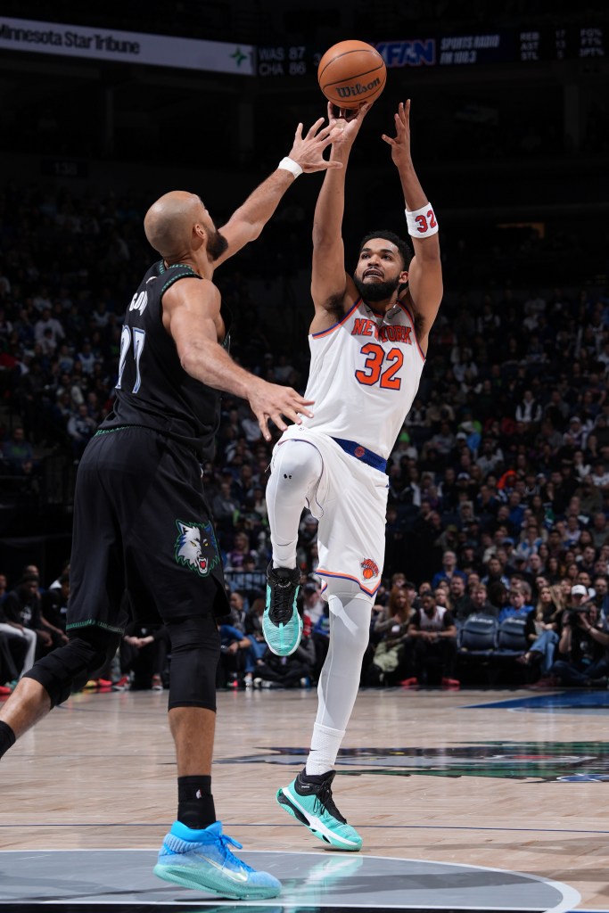  Karl-Anthony Towns #32 of the New York Knicks shoots the ball during the game against the Minnesota Timberwolves on December 23, 2025 at Target Center in Minneapolis, Minnesota. 