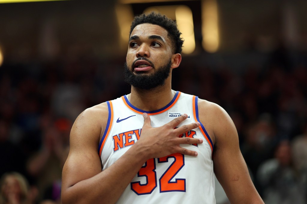 Karl-Anthony Towns #32 of the New York Knicks acknowledges fans in the fourth quarter of the game against the Minnesota Timberwolves at Target Center on December 23, 2025 in Minneapolis, Minnesota.
