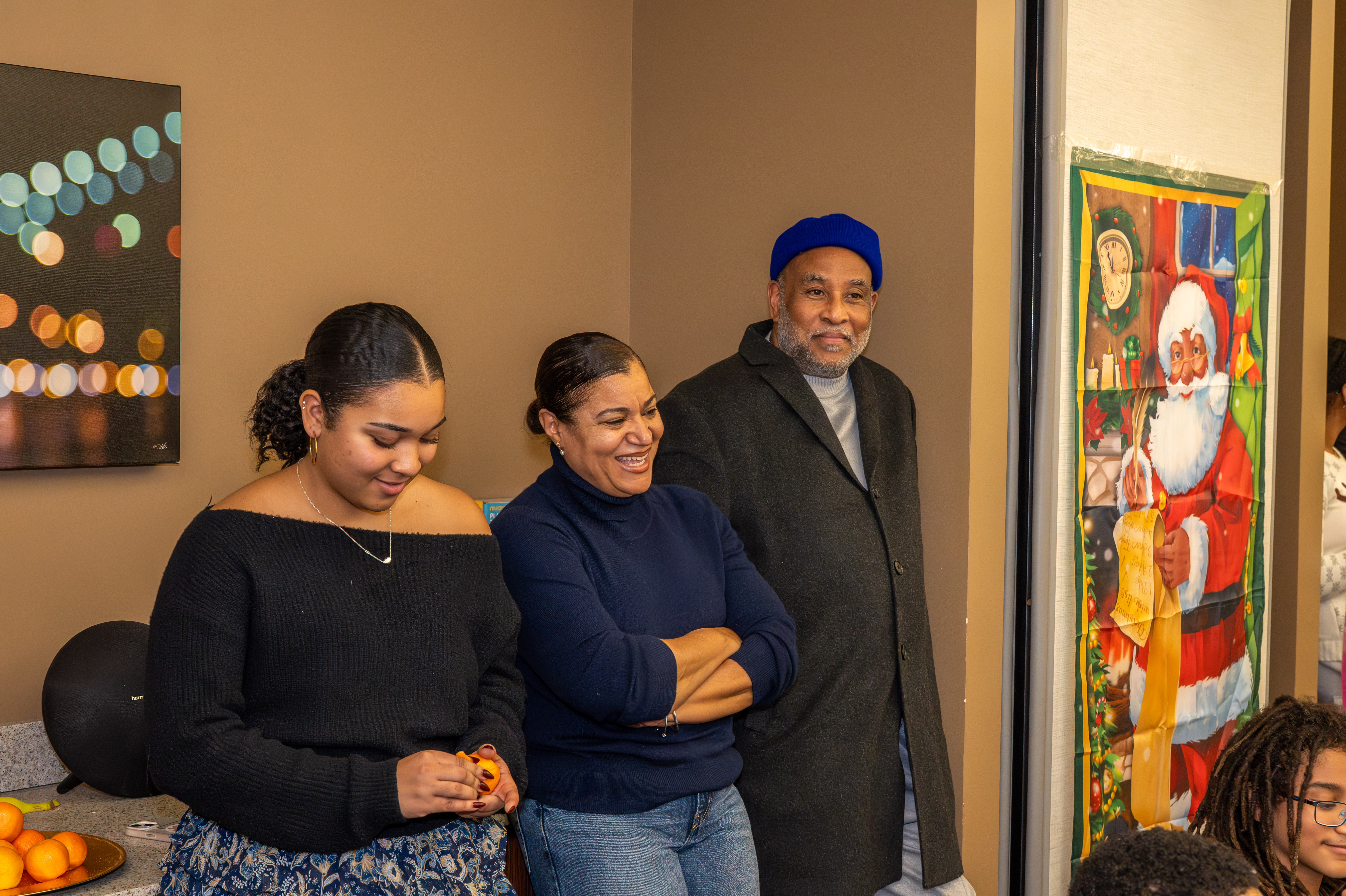 Student pilot Sophie Robinson, 16, with her parents, Martine Henriguez and Lenny Robinson, at a meeting of Jack and Jill of America, Staten Island Tweens, at the College of Staten Island in Willowbrook on Saturday, Dec. 20, 2025. (Owen Reiter for the Advance/SILive.com)
