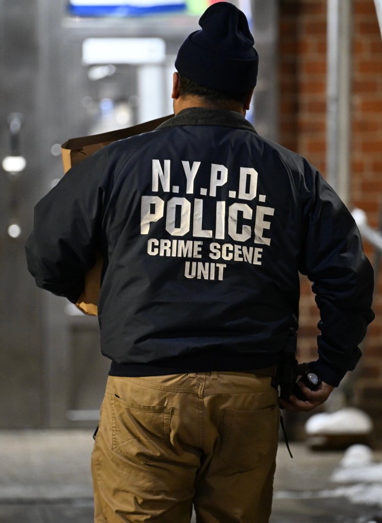 NYPD Crime Scene Unit officer at the scene of a fatal shooting in the Bronx, New York.