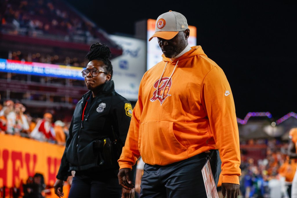 Todd Bowles walks off the field following a loss to the Falcons in December 2025.