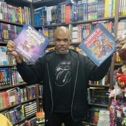 Darryl McDaniels holding his first book, “Darryl’s Dream,” and his newest release, “Darryl's Christmas in Hollis.” Brooklyn Eagle photo by Wayne Daren Schneiderman