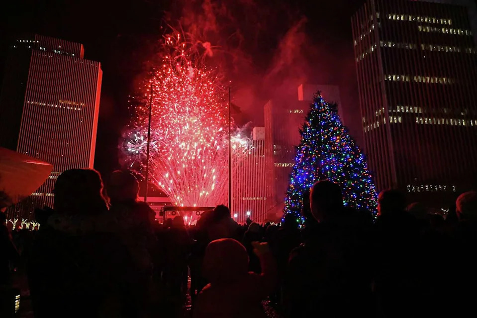 Fireworks go off at the Empire State Plaza during the New York State Tree Lighting and Firework Festival on Sunday in Albany. The event drew crowds to the capital's downtown to celebrate the season. (Lori Van Buren/Times Union)