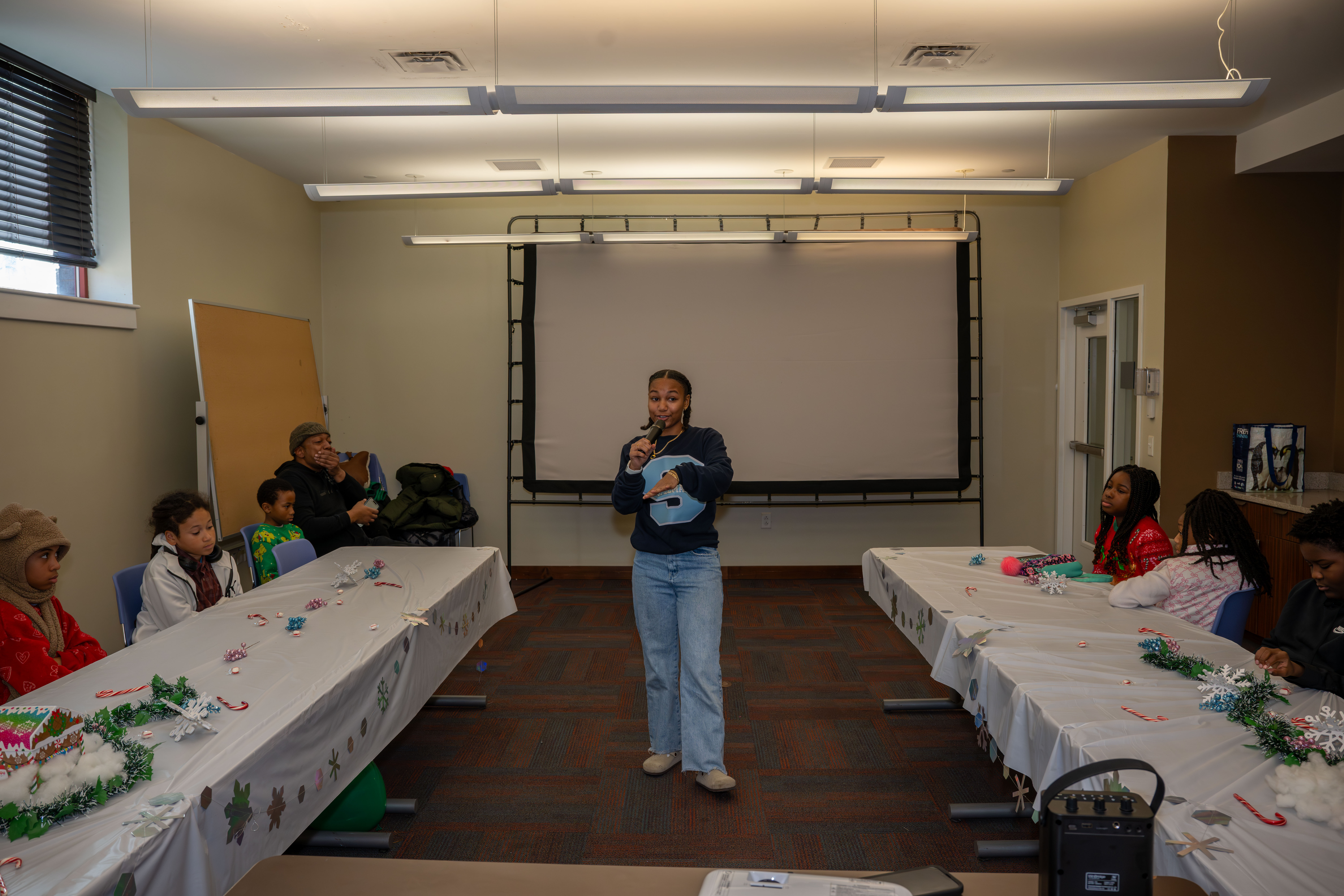 Kamora Freelend, the youngest African-American female pilot to earn her private pilot's license, speaks to middle school students at a meeting of Jack and Jill of America, Staten Island Tweens, at the College of Staten Island in Willowbrook on Saturday, Dec. 20, 2025. (Owen Reiter for the Advance/SILive.com)