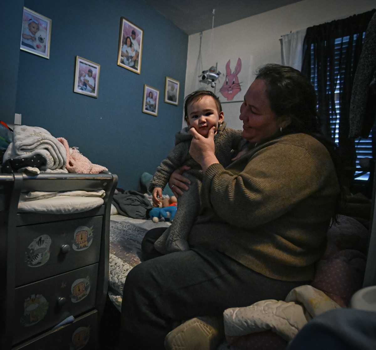 mom holding baby while husband and father are in ICE custody