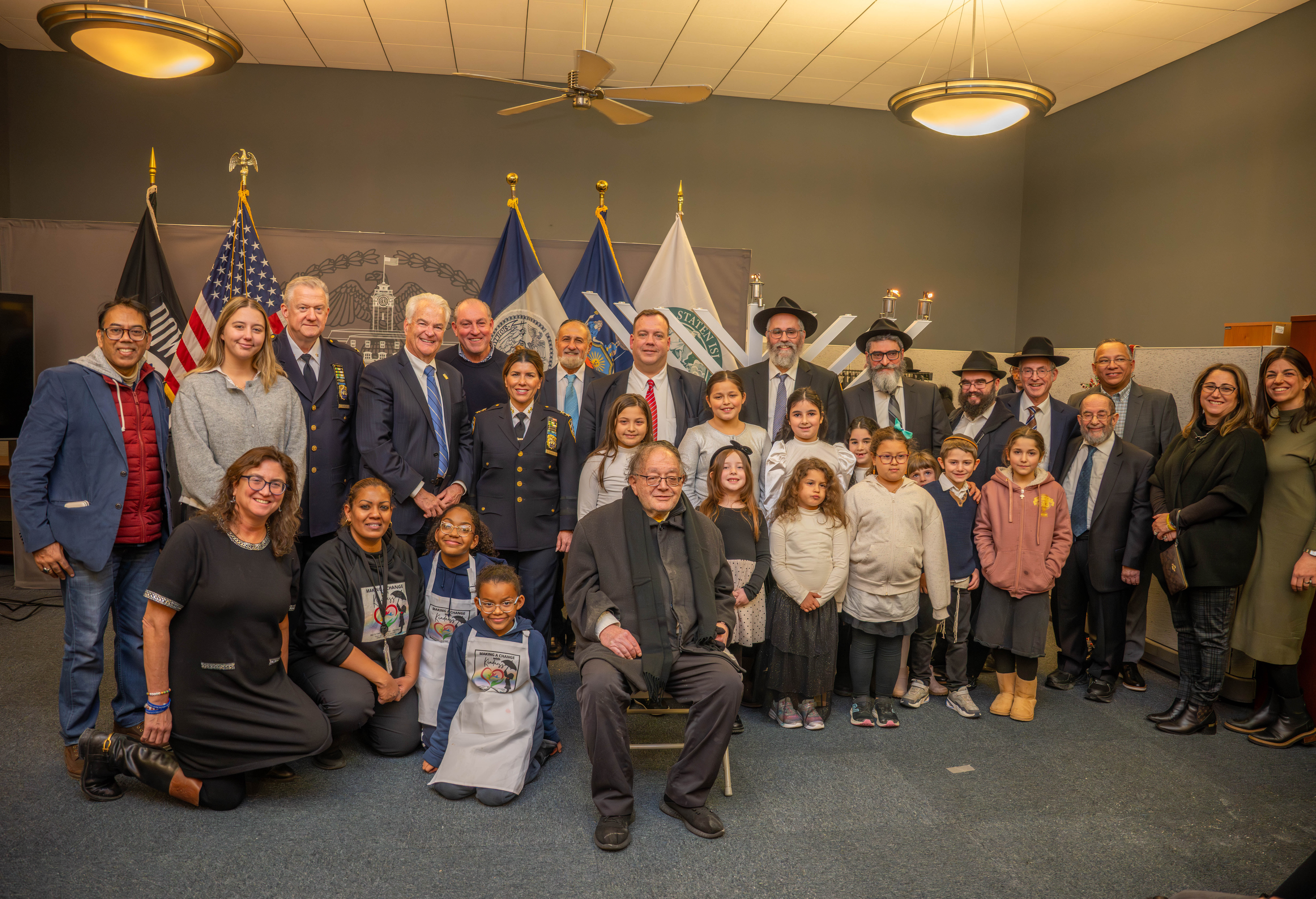 District Attorney Michael E. McMahon, Borough President Vito J. Fossella, NYPD Chiefs Melissa Eger and Terence Hurson gather with Mendy Mirocznik, president of the Council of Jewish Organizations, for the 54th annual menorah lighting at Staten Island Borough Hall on Monday, December 15, 2025. (Owen Reiter for the Advance/SILive.com)