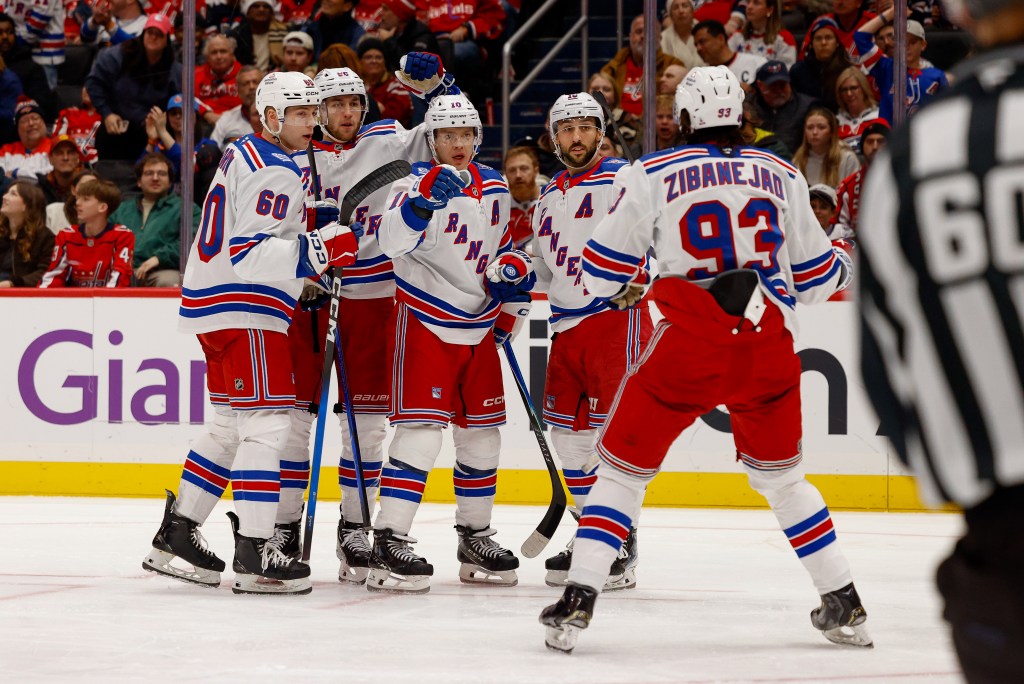 Will Cuylle #50 of the New York Rangers celebrates a goal with teammates in the second period against the Washington Capitals.