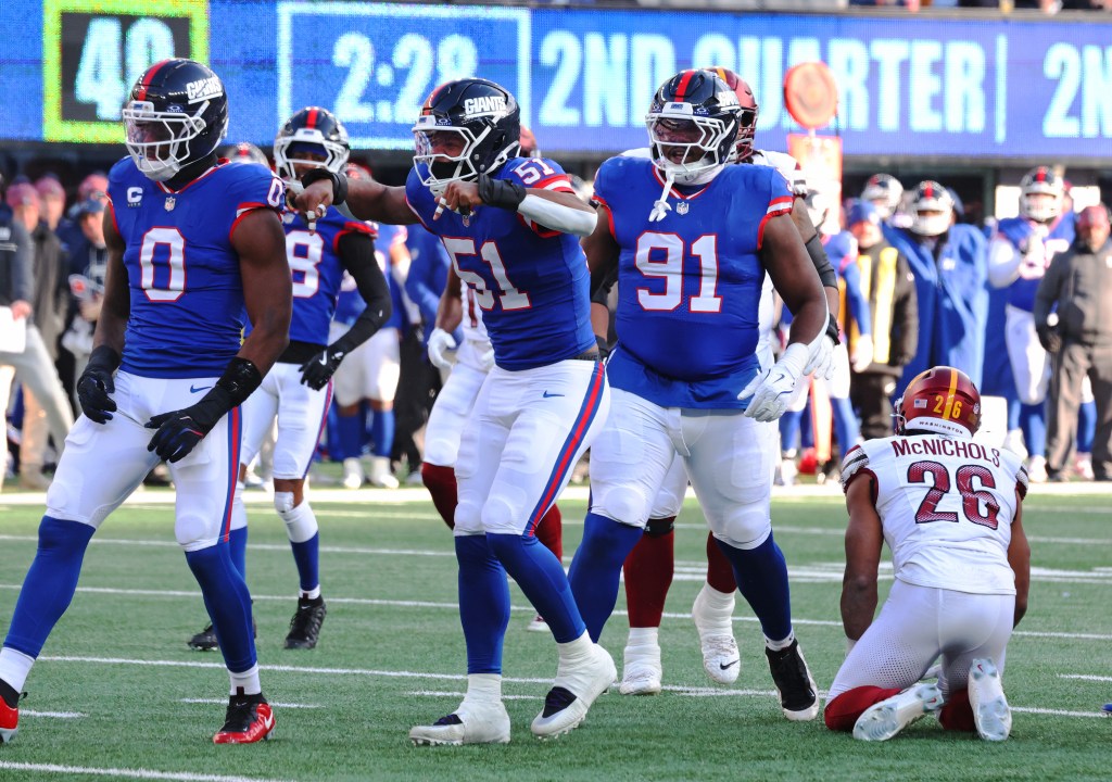 New York Giants linebacker Abdul Carter #51 celebrates after tackling Washington Commanders running back Jeremy McNichols #26.